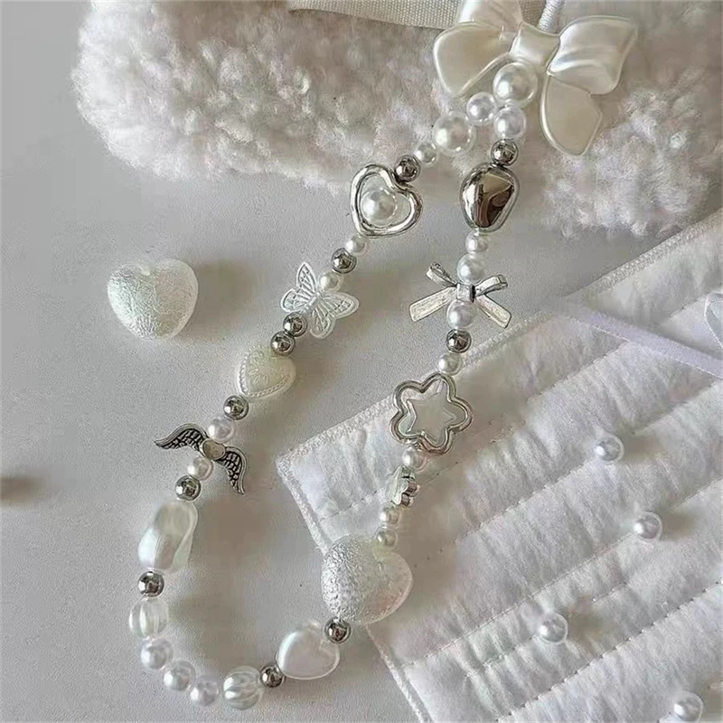 Perlen-Handyketten-Charm-Lanyard für iPhone Samsung, niedliche barocke weiße Schleife, Blumen-Charm, universelles Zubehör, Schmuckanhänger – Bild 3